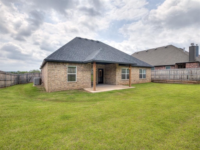 2257 Preserve Edge Dr, Edmond, OK 73034 - back of house featuring cooling unit, a patio area, a shingled roof, and brick siding