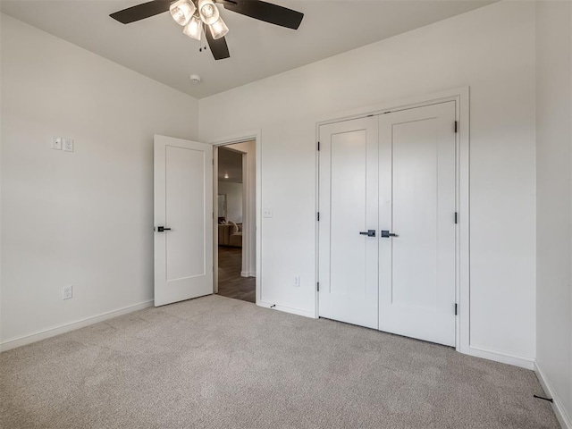 2257 Preserve Edge Dr, Edmond, OK 73034 - unfurnished bedroom featuring carpet, baseboards, a closet, and a ceiling fan