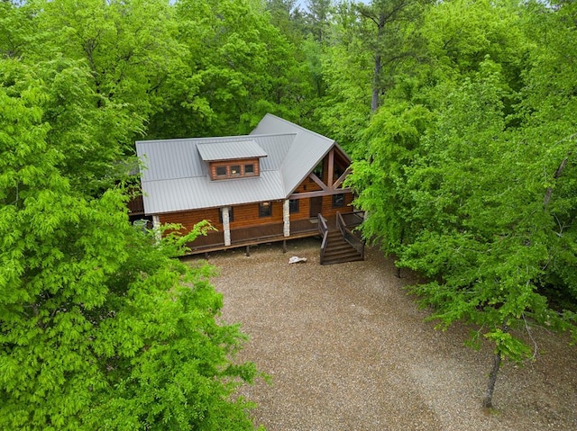 186 W Eagle Mountain Trl, Broken Bow, OK 74728 - view of front of house with a metal roof, stairway, and a wooded view