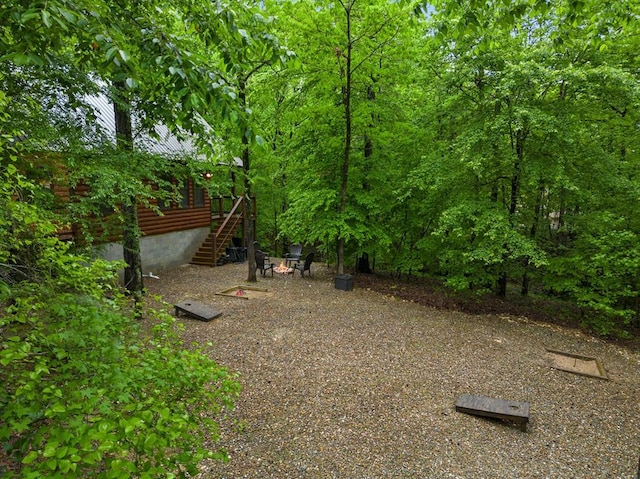 186 W Eagle Mountain Trl, Broken Bow, OK 74728 - view of yard with stairway and a deck
