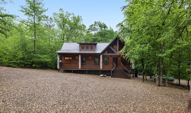 186 W Eagle Mountain Trl, Broken Bow, OK 74728 - rustic home with a porch and a metal roof
