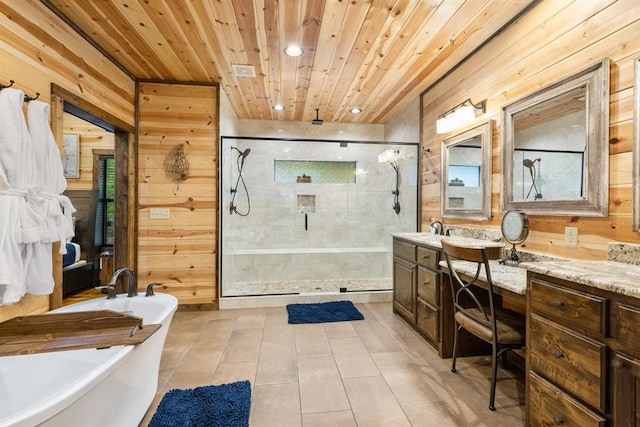 186 W Eagle Mountain Trl, Broken Bow, OK 74728 - bathroom with a soaking tub, double vanity, a shower stall, wooden walls, and tile patterned flooring