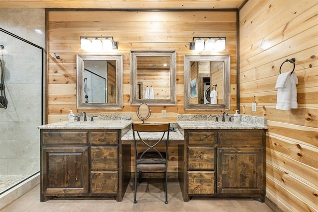 186 W Eagle Mountain Trl, Broken Bow, OK 74728 - bathroom featuring wooden walls, double vanity, a stall shower, and tile patterned floors