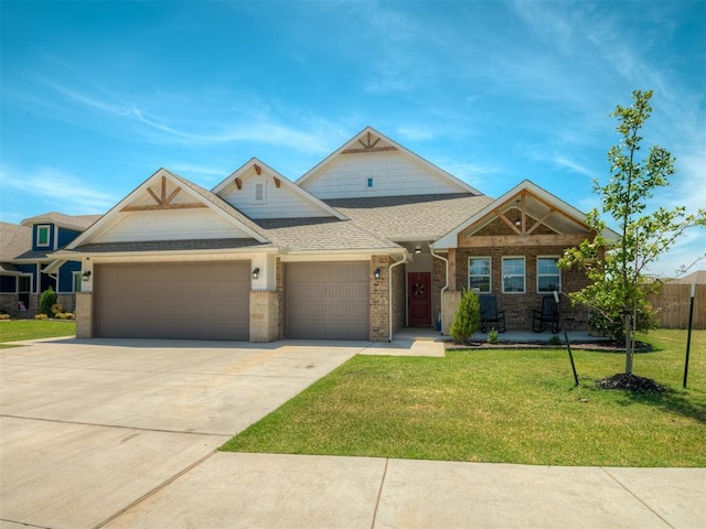 11052 NW 21st St, Yukon, OK 73099 - view of front of house featuring a garage, driveway, and a shingled roof