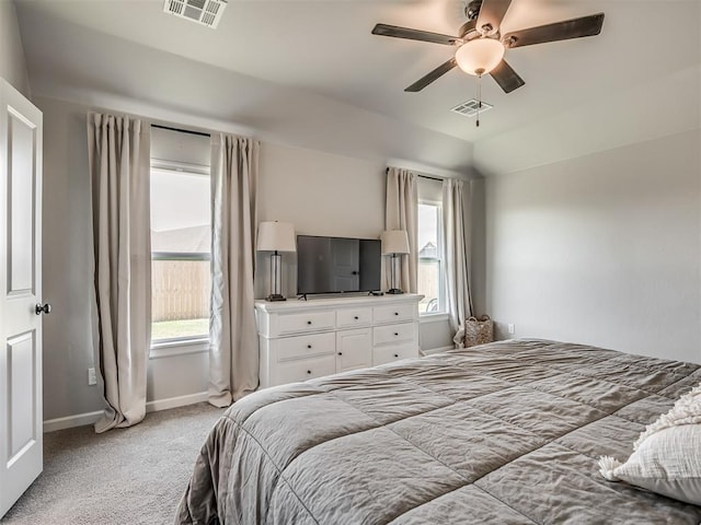 11052 NW 21st St, Yukon, OK 73099 - bedroom featuring baseboards, light carpet, and a ceiling fan