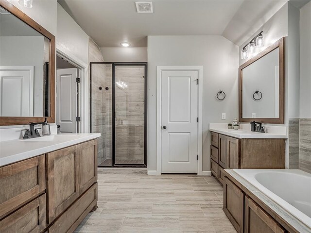 11052 NW 21st St, Yukon, OK 73099 - full bath featuring a shower stall, two vanities, and a garden tub
