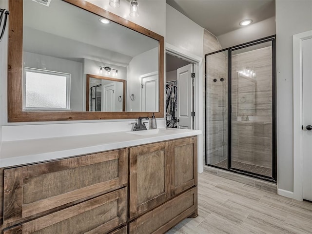 11052 NW 21st St, Yukon, OK 73099 - full bathroom featuring a stall shower, vanity, and a spacious closet