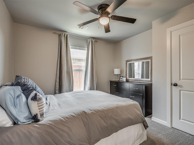 11052 NW 21st St, Yukon, OK 73099 - carpeted bedroom with ceiling fan and baseboards
