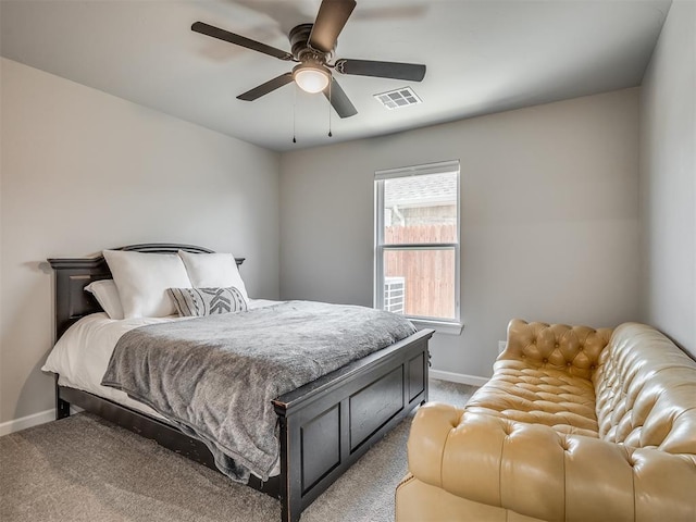 11052 NW 21st St, Yukon, OK 73099 - bedroom with light carpet, baseboards, and a ceiling fan