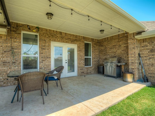 11052 NW 21st St, Yukon, OK 73099 - view of patio with french doors and area for grilling