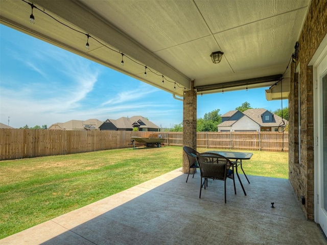 11052 NW 21st St, Yukon, OK 73099 - view of patio featuring outdoor dining area and a residential view