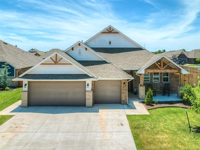 11052 NW 21st St, Yukon, OK 73099 - view of front of house featuring roof with shingles, an attached garage, driveway, and a front lawn