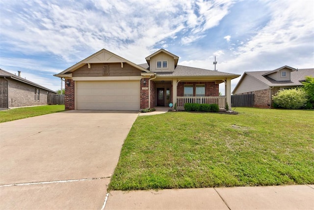 2345 NW 191st Ct, Edmond, OK 73012 - view of front of house with brick siding, a porch, concrete driveway, and a garage