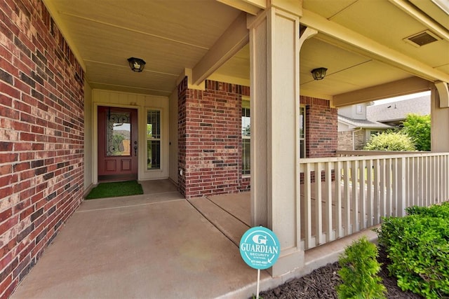2345 NW 191st Ct, Edmond, OK 73012 - entrance to property featuring brick siding and covered porch
