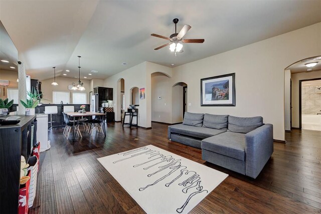 2345 NW 191st Ct, Edmond, OK 73012 - living area with arched walkways, ceiling fan, dark wood finished floors, lofted ceiling, and recessed lighting
