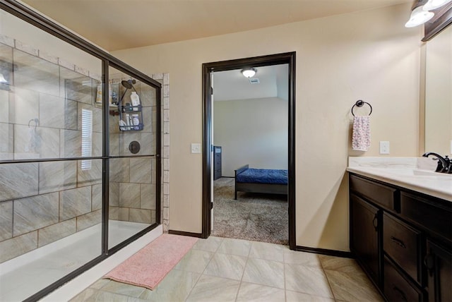 2345 NW 191st Ct, Edmond, OK 73012 - ensuite bathroom with a shower stall, vanity, and baseboards