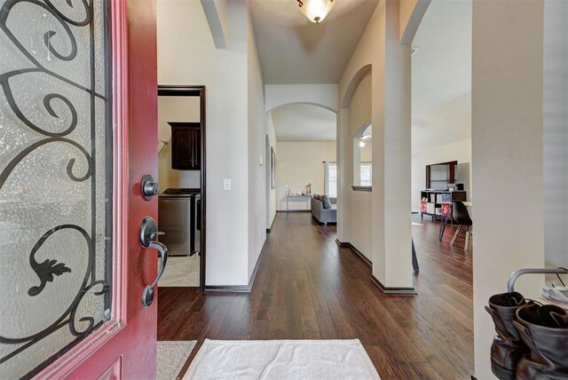 2345 NW 191st Ct, Edmond, OK 73012 - foyer entrance featuring arched walkways, dark wood-type flooring, and baseboards