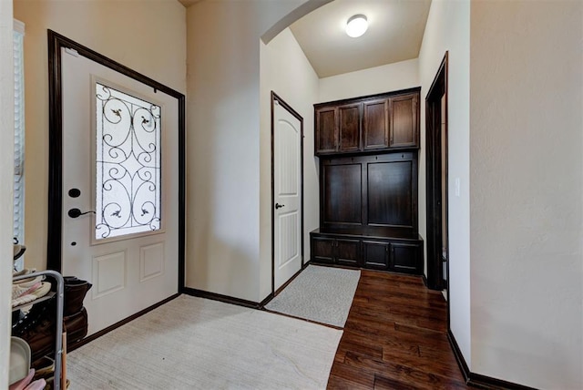 2345 NW 191st Ct, Edmond, OK 73012 - foyer with arched walkways, light wood-style floors, and baseboards