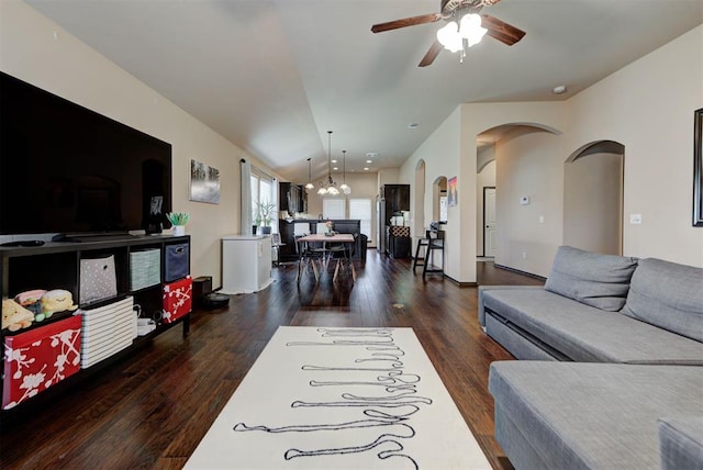 2345 NW 191st Ct, Edmond, OK 73012 - living area with a ceiling fan, wood finished floors, arched walkways, a chandelier, and vaulted ceiling