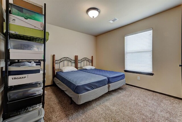 2345 NW 191st Ct, Edmond, OK 73012 - bedroom with carpet and baseboards