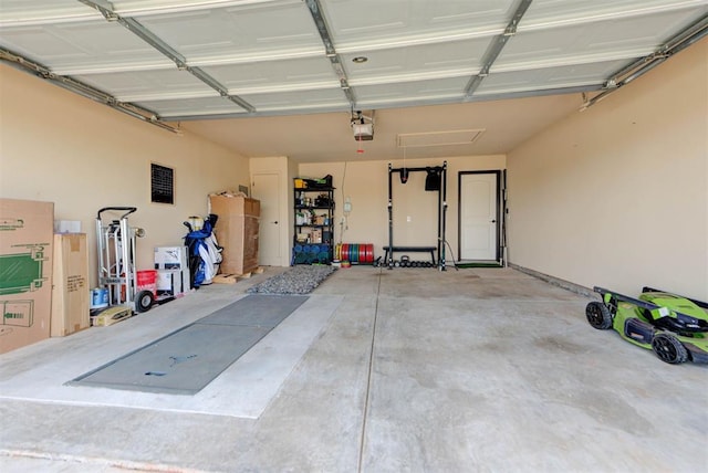 2345 NW 191st Ct, Edmond, OK 73012 - garage featuring a garage door opener