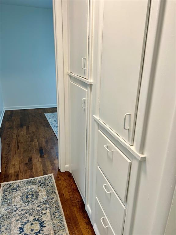 414 N 1st St, Tecumseh, OK 74873 - hallway with dark wood-type flooring