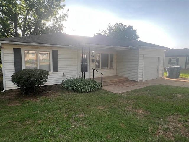 414 N 1st St, Tecumseh, OK 74873 - view of front of home with an attached garage, concrete driveway, a front yard, and covered porch