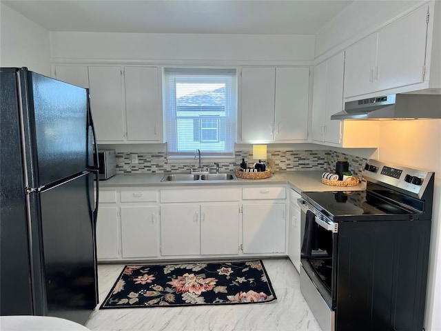 414 N 1st St, Tecumseh, OK 74873 - kitchen with freestanding refrigerator, stainless steel electric range oven, a sink, under cabinet range hood, and light countertops