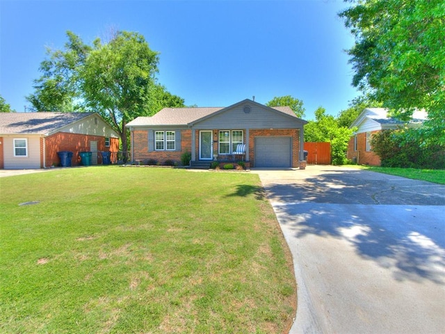2748 Lancaster Ln, Oklahoma City, OK 73116 - ranch-style house featuring brick siding, a garage, and driveway