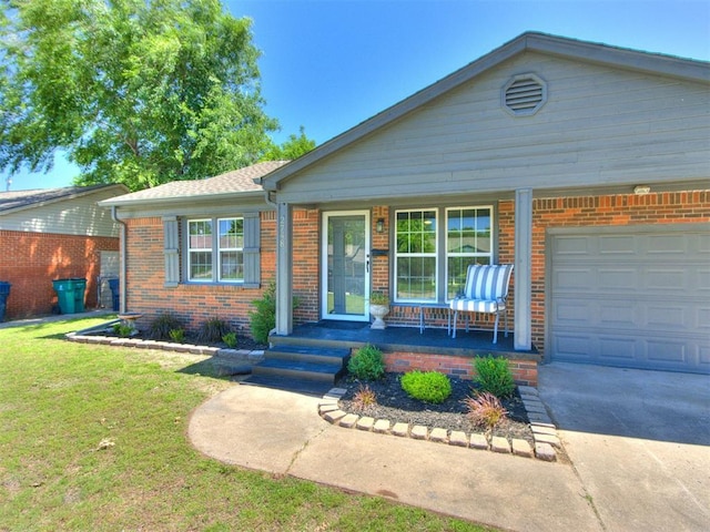 2748 Lancaster Ln, Oklahoma City, OK 73116 - ranch-style house with brick siding, covered porch, a garage, a front yard, and concrete driveway