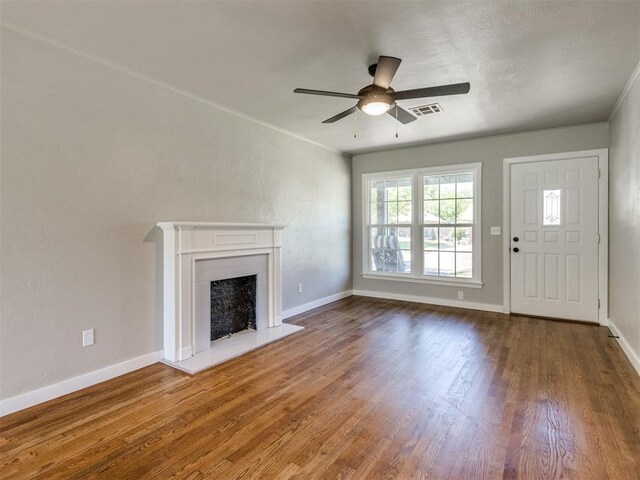2748 Lancaster Ln, Oklahoma City, OK 73116 - unfurnished living room with wood finished floors, ceiling fan, and baseboards
