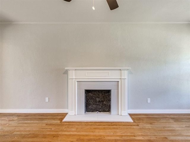 2748 Lancaster Ln, Oklahoma City, OK 73116 - detailed view of a ceiling fan, wood finished floors, a fireplace, and baseboards