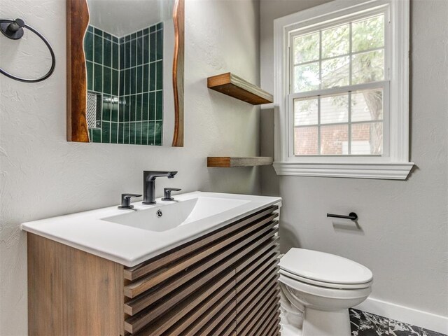 2748 Lancaster Ln, Oklahoma City, OK 73116 - bathroom featuring vanity, toilet, and baseboards