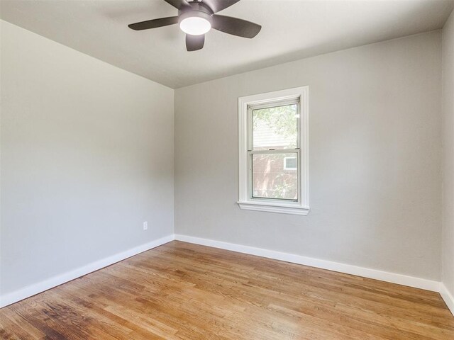 2748 Lancaster Ln, Oklahoma City, OK 73116 - empty room with baseboards, wood finished floors, and ceiling fan