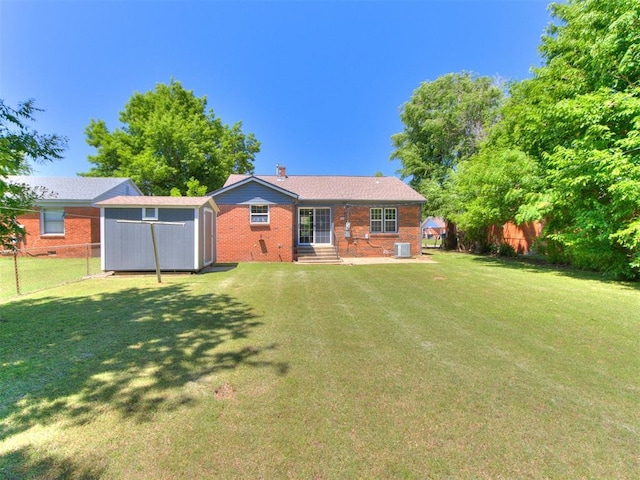 2748 Lancaster Ln, Oklahoma City, OK 73116 - rear view of property with brick siding, central air condition unit, and entry steps