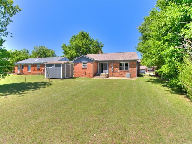 2748 Lancaster Ln, Oklahoma City, OK 73116 - rear view of house with central AC, a chimney, a yard, and brick siding