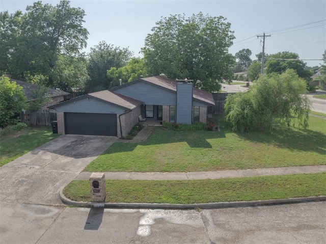 3501 Necia St, Moore, OK 73160 - view of front of house with brick siding, a garage, concrete driveway, and a chimney