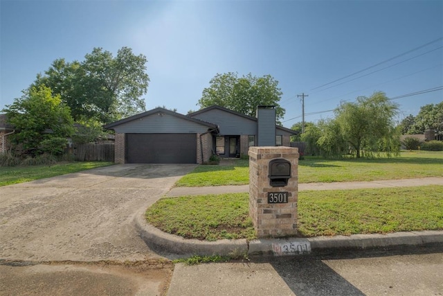 3501 Necia St, Moore, OK 73160 - mid-century inspired home with a garage, concrete driveway, and brick siding