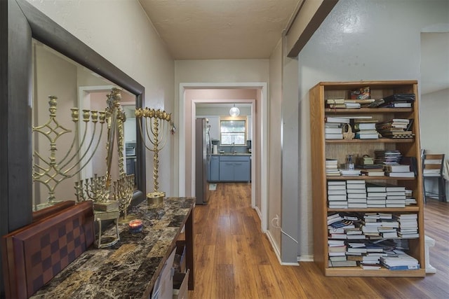 3501 Necia St, Moore, OK 73160 - hall with wood finished floors and a sink