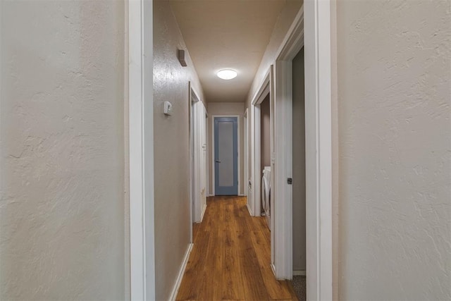 3501 Necia St, Moore, OK 73160 - corridor featuring wood finished floors and a textured wall