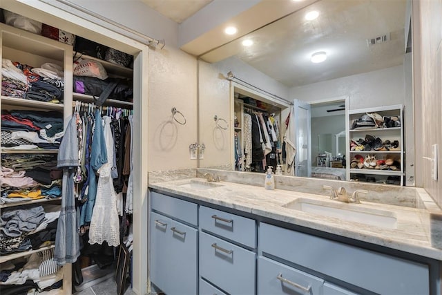 3501 Necia St, Moore, OK 73160 - bathroom featuring double vanity and a spacious closet