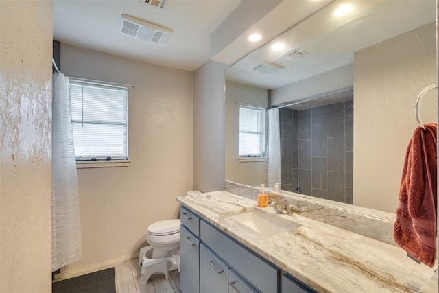 3501 Necia St, Moore, OK 73160 - full bath featuring curtained shower, vanity, toilet, baseboards, and recessed lighting