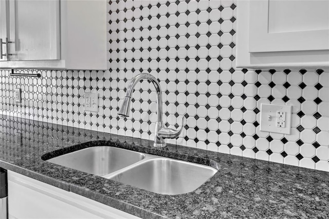 8116 NW 82nd St, Oklahoma City, OK 73132 - kitchen view of a sink, backsplash, pot filler, white cabinets, and dark stone countertops