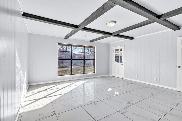 8116 NW 82nd St, Oklahoma City, OK 73132 - empty room with baseboards, marble look tile flooring, beamed ceiling, wooden walls, and coffered ceiling