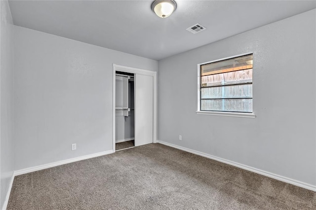 8116 NW 82nd St, Oklahoma City, OK 73132 - unfurnished bedroom with carpet flooring, baseboards, and a closet