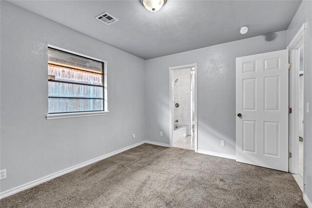 8116 NW 82nd St, Oklahoma City, OK 73132 - unfurnished bedroom with carpet flooring, baseboards, and ensuite bath
