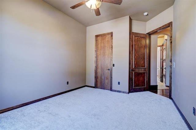 3101 Monica Ln, Moore, OK 73160 - carpeted bedroom with arched walkways and ceiling fan