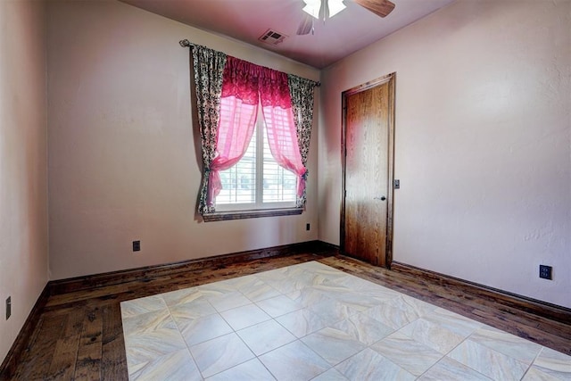 3101 Monica Ln, Moore, OK 73160 - empty room with a ceiling fan and wood finished floors