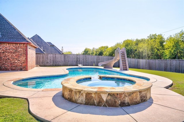 3101 Monica Ln, Moore, OK 73160 - view of pool with a water slide, a fenced backyard, and a pool with connected hot tub