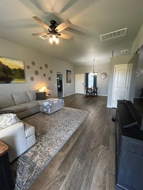 9525 SW 27th St, Oklahoma City, OK 73128 - living area with a ceiling fan, dark wood-style flooring, and baseboards